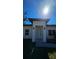 Modern home showcasing a clean, white facade, dark trim and ample natural light at 17065 Malta Ave Ave, Port Charlotte, FL 33954