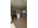 Open-concept kitchen with island, modern appliances, and wood-style flooring at 17065 Malta Ave Ave, Port Charlotte, FL 33954