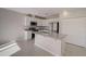 Modern kitchen featuring an island, stainless appliances, and white cabinetry at 2258 Sulstone Dr, Punta Gorda, FL 33983