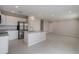 Bright open kitchen featuring an island, stainless steel appliances, and tile flooring at 2258 Sulstone Dr, Punta Gorda, FL 33983