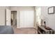Bedroom featuring a closet, side table, and window with natural light at 2349 Broadpoint Dr, Punta Gorda, FL 33983