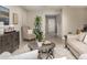 Comfortable living room with stylish decor, plush seating, and an open layout that enhances the home's airy feel at 2349 Broadpoint Dr, Punta Gorda, FL 33983