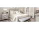 Serene main bedroom featuring neutral tones, soft bedding, and an en-suite bathroom for a private retreat at 2349 Broadpoint Dr, Punta Gorda, FL 33983
