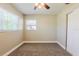 Cozy bedroom with carpeted floors, ceiling fan and natural light at 2500 Erie S St, St Petersburg, FL 33712