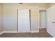 Bedroom with closet, neutral paint, carpeted floors, and bright light at 2500 Erie S St, St Petersburg, FL 33712