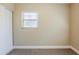 Bedroom with closet, neutral paint, carpeted floor, and a bright window at 2500 Erie S St, St Petersburg, FL 33712