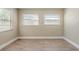 Bright bedroom with wood-look flooring and two large windows at 2500 Erie S St, St Petersburg, FL 33712