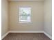 Bedroom with neutral paint, large window, carpeted floor, and bright light at 2500 Erie S St, St Petersburg, FL 33712