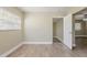 Bright bedroom featuring a large window and wood-look laminate flooring at 2500 Erie S St, St Petersburg, FL 33712