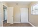 Bedroom featuring closet, large window, neutral paint, and carpeted floors at 2500 Erie S St, St Petersburg, FL 33712