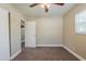 Bedroom with closet, neutral paint, carpeted floors, and window at 2500 Erie S St, St Petersburg, FL 33712