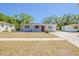 Charming single-story home with a well-maintained lawn and a welcoming red front door at 2500 Erie S St, St Petersburg, FL 33712