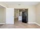 Open living room showcasing new flooring and updated kitchen appliances at 2500 Erie S St, St Petersburg, FL 33712