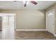 Spacious living room featuring wood-look flooring and a ceiling fan at 2500 Erie S St, St Petersburg, FL 33712