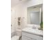 Bathroom featuring a tub, a toilet and a white vanity with neutral colored walls at 25575 Calusa Dr, Punta Gorda, FL 33955