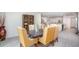 Dining room with bookshelf, table with six chairs, and open layout to kitchen at 25575 Calusa Dr, Punta Gorda, FL 33955