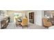 Dining area with stylish table and chairs, adjacent to bright, open living spaces at 25575 Calusa Dr, Punta Gorda, FL 33955