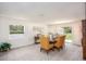 Bright dining room featuring carpet, modern decor and seating for six at 25575 Calusa Dr, Punta Gorda, FL 33955