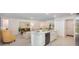 Bright kitchen with an island, modern appliances, and seamless flow into living spaces at 25575 Calusa Dr, Punta Gorda, FL 33955