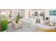 Open-concept living area blending kitchen, living, and dining spaces for modern living at 25575 Calusa Dr, Punta Gorda, FL 33955