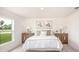 Cozy main bedroom featuring neutral tones, soft lighting, and ample natural light at 25575 Calusa Dr, Punta Gorda, FL 33955