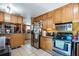 View of kitchen featuring an island with seating, stainless steel appliances, and lots of cabinet space at 5224 29Th S Ave, Gulfport, FL 33707