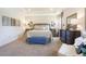 Serene main bedroom with tray ceilings, neutral tones, and an en-suite bathroom at 25408 Jubal St, Punta Gorda, FL 33955