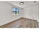 Clean, bright bedroom with wood floors and a large window at 8123 Double Branch Rd # 1, Tampa, FL 33635