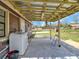 Covered patio featuring laundry hookups with a view of the lawn at 8123 Double Branch Rd # 1, Tampa, FL 33635