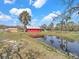 A serene pond on the property provides a peaceful natural water feature and enhances the landscape at 8123 Double Branch Rd # 1, Tampa, FL 33635