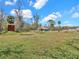 Lush property with a house and multiple sheds, offering ample space and storage at 8123 Double Branch Rd # 1, Tampa, FL 33635
