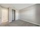 This bedroom features neutral carpet and double door closet for ample storage at 4914 Carova Way, Lakewood Ranch, FL 34211