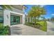 Beautiful clubhouse entrance with lush landscaping and a welcoming walkway at 4914 Carova Way, Lakewood Ranch, FL 34211