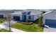 A well-maintained home with lush green lawn, mature tree, and tile roof at 4914 Carova Way, Lakewood Ranch, FL 34211