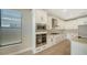 Beautiful kitchen with white cabinets, stainless steel appliances and light countertops at 4914 Carova Way, Lakewood Ranch, FL 34211