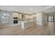 Bright kitchen with island, stainless appliances, hard surface floors, and pendant lights at 4914 Carova Way, Lakewood Ranch, FL 34211