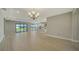 Open living area with large sliding glass doors, recessed lights and view to backyard at 4914 Carova Way, Lakewood Ranch, FL 34211