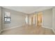 Light hardwood floors, a window, and natural light define this main bedroom at 4914 Carova Way, Lakewood Ranch, FL 34211