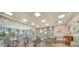 Well-lit meeting room with tables, chairs, and large windows with outside views at 4914 Carova Way, Lakewood Ranch, FL 34211