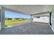 The large paved patio offers views of the lake, grass lawn, and surrounding community at 4914 Carova Way, Lakewood Ranch, FL 34211