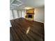 Finished basement with a stone fireplace and multiple doors at 6405 Gainsboro Dr, Port Richey, FL 34668