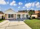 Charming single-story home featuring a well-manicured lawn and beautiful brick and stone accents at 8326 Iberia Pl, Tampa, FL 33637