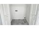 A clean, well-lit laundry room or closet with tile floor and washer/dryer hookups at 8326 Iberia Pl, Tampa, FL 33637