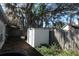 View of backyard featuring a utility shed and fenced perimeter at 2632 Wrencrest Cir, Valrico, FL 33596