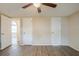 This bedroom has three doors and neutral paint, creating a light and airy feel at 9811 Rainbow Ln, Port Richey, FL 34668