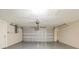 Interior view of garage with white walls and overhead door at 9811 Rainbow Ln, Port Richey, FL 34668