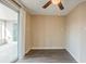 This living room offers a view of the patio and neutral paint to match any decor at 9811 Rainbow Ln, Port Richey, FL 34668