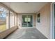 Screened porch with a view of the fenced backyard at 9811 Rainbow Ln, Port Richey, FL 34668