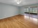 Spacious main bedroom with a balcony overlooking a golf course at 13516 Palmwood Ln, Tampa, FL 33618