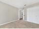 Spacious bedroom featuring neutral walls and plush carpet, offering a serene living space at 1729 Nelda Ln, Sarasota, FL 34232